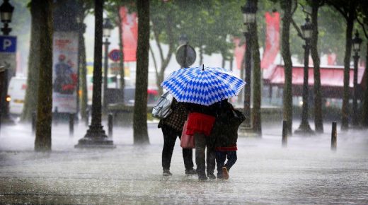 People walk under the heavy rain on the ...People walk under the heavy rain on the Champs-Elys es avenue on June 17, 2013 in Paris. AFP PHOTO / FRANCOIS GUILLOTFRANCOIS GUILLOT/AFP/Getty Images