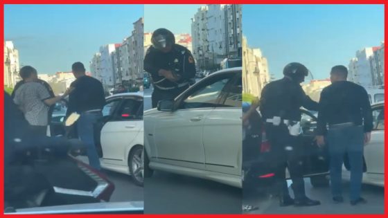 شرطي مرور يشهر سلاحه الوظيفي في مواجهة أحد مستعملي الطريق، والذي يشتبه في تورطه في عدم الامتثال.